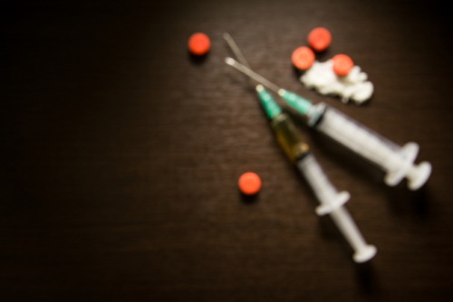 Picture of drug syringe and cooked heroin